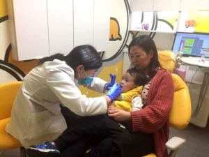 Dr. Gloria with patient