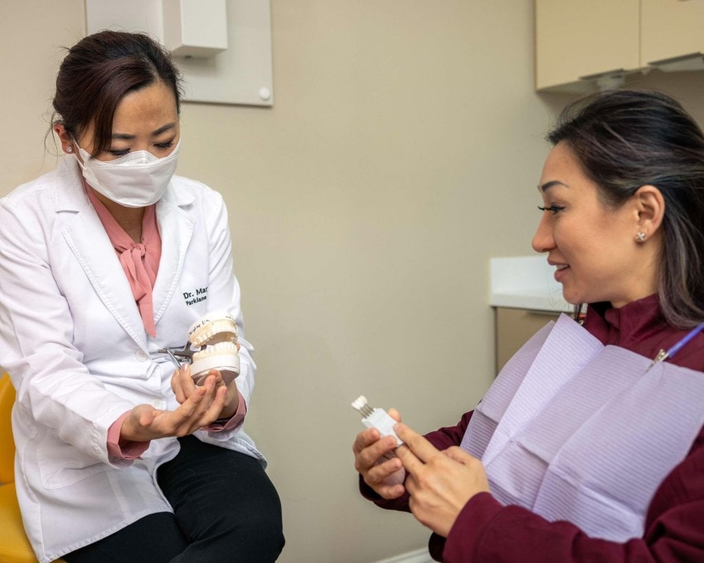 Cosmetic Dentist reviewing dental veneers for smile makeover with cosmetic dentistry at Parklane Dental