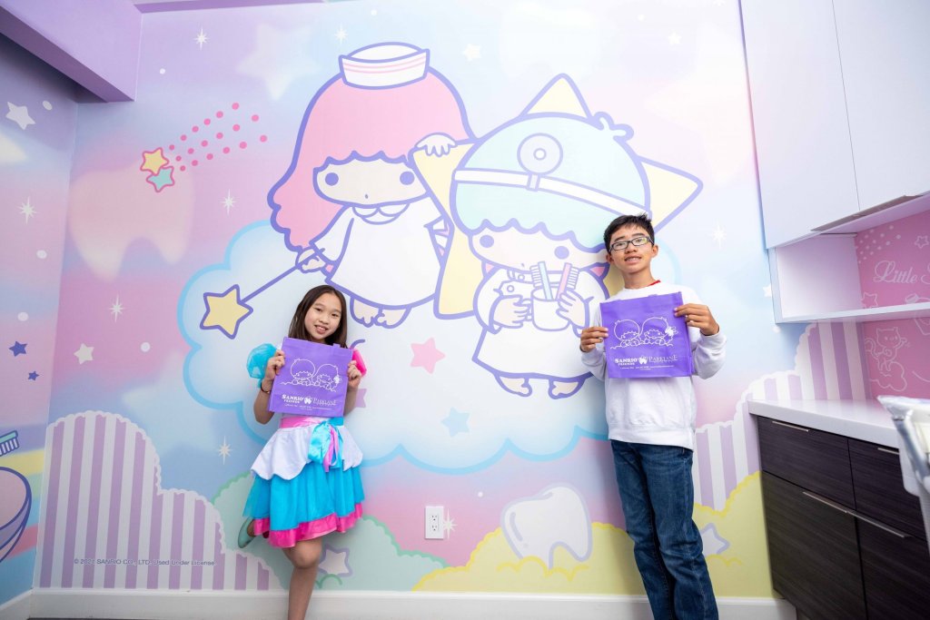 Child enjoying dental visit with Little Twin Stars decor