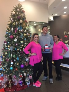 Adult dental patient with gift for Arcadia dental team