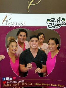Adult male dental patient appreciating dental team at Parklane Dental in Arcadia