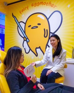 General Dentist Dr. Elizabeth Hsi conducting dental exam with adult patient