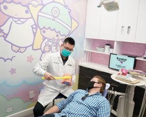General Doctor Teaching Adult Patient Dental Habits