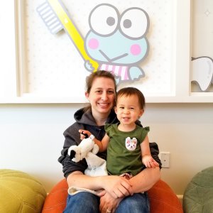 Mom and pediatric child after visit with Hello Kitty dental office